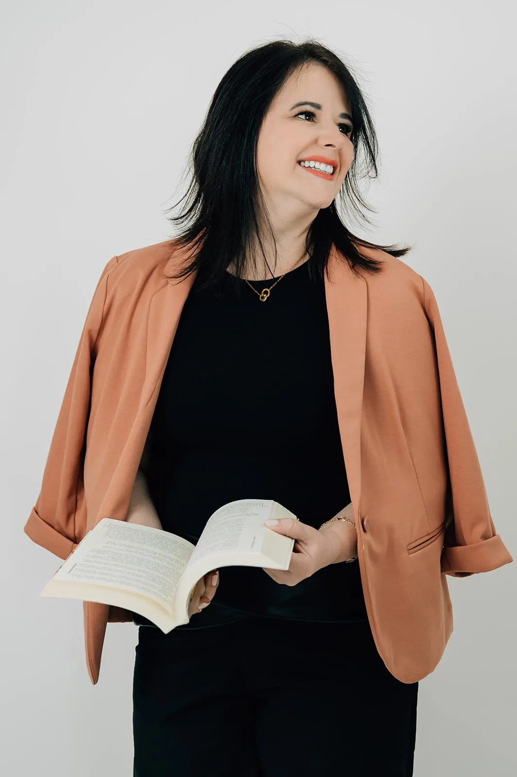 Luísa Marteleto with an open book